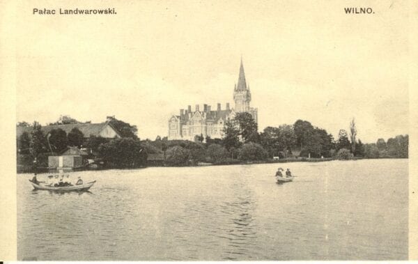 Antique postcard showing a lakeside palace with spire, rowing boats on calm water, and wooded shore
