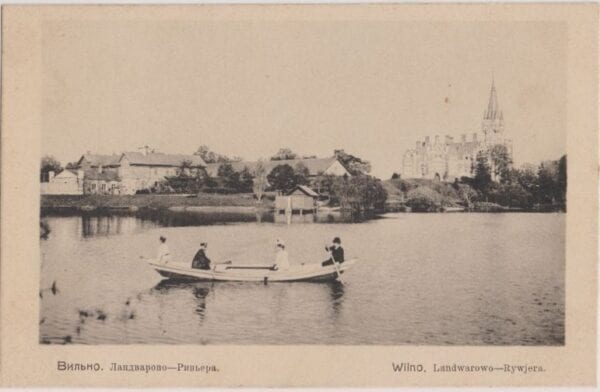 Vintage postcard showing rowing boat with passengers on a lake before a palace and town