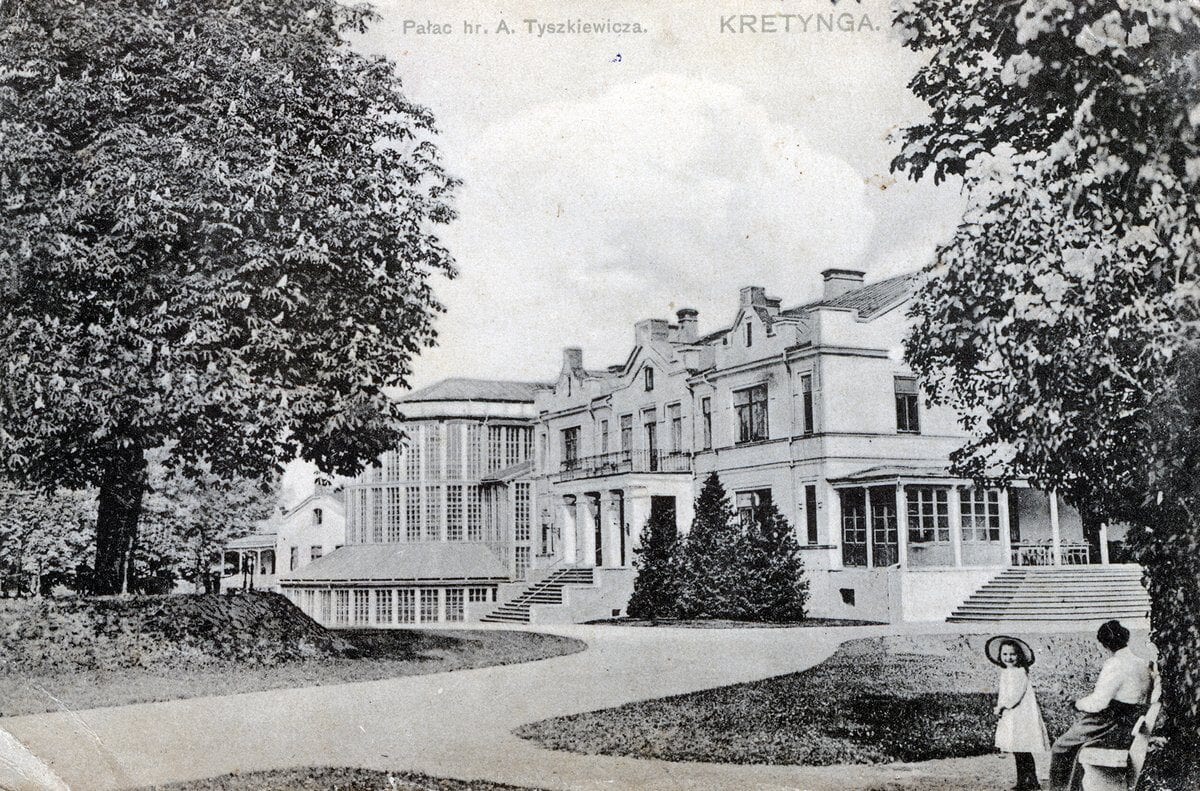 Kretinga Manor Palace Historic Postcard Vintage postcard showing a large white manor house with winter garden, trees and paths, woman and child nearby